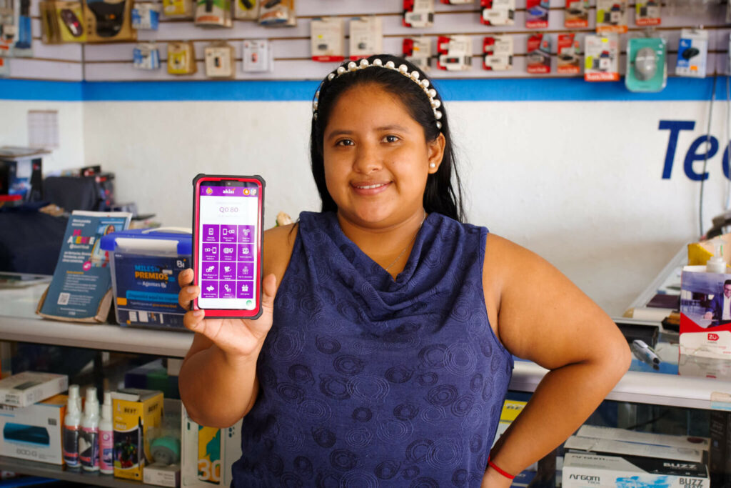 Eymi Susana Tux Ix shows her digital finance app