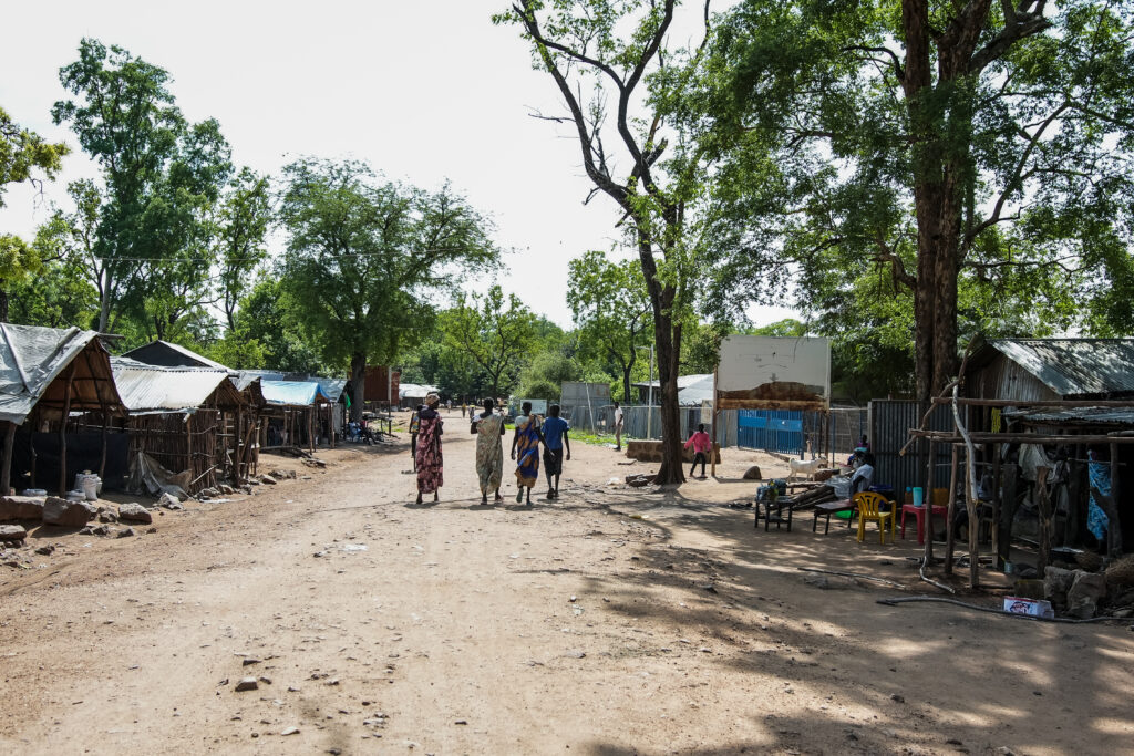 Few people walking on the road.  