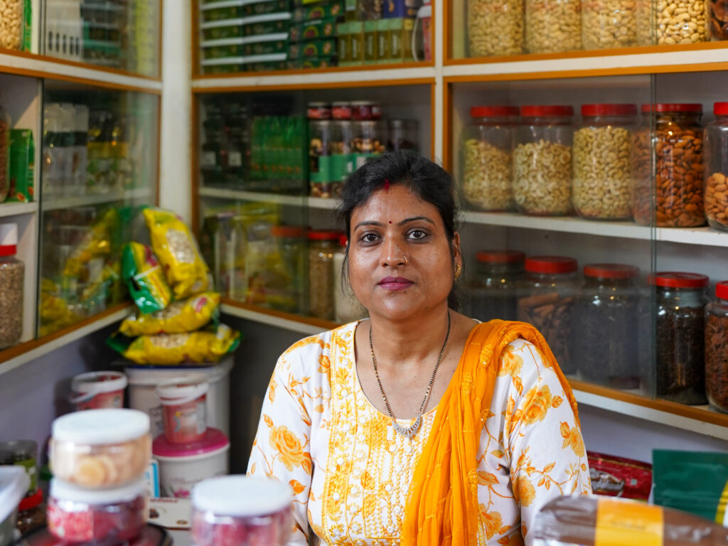 A women standing in her grocery store.