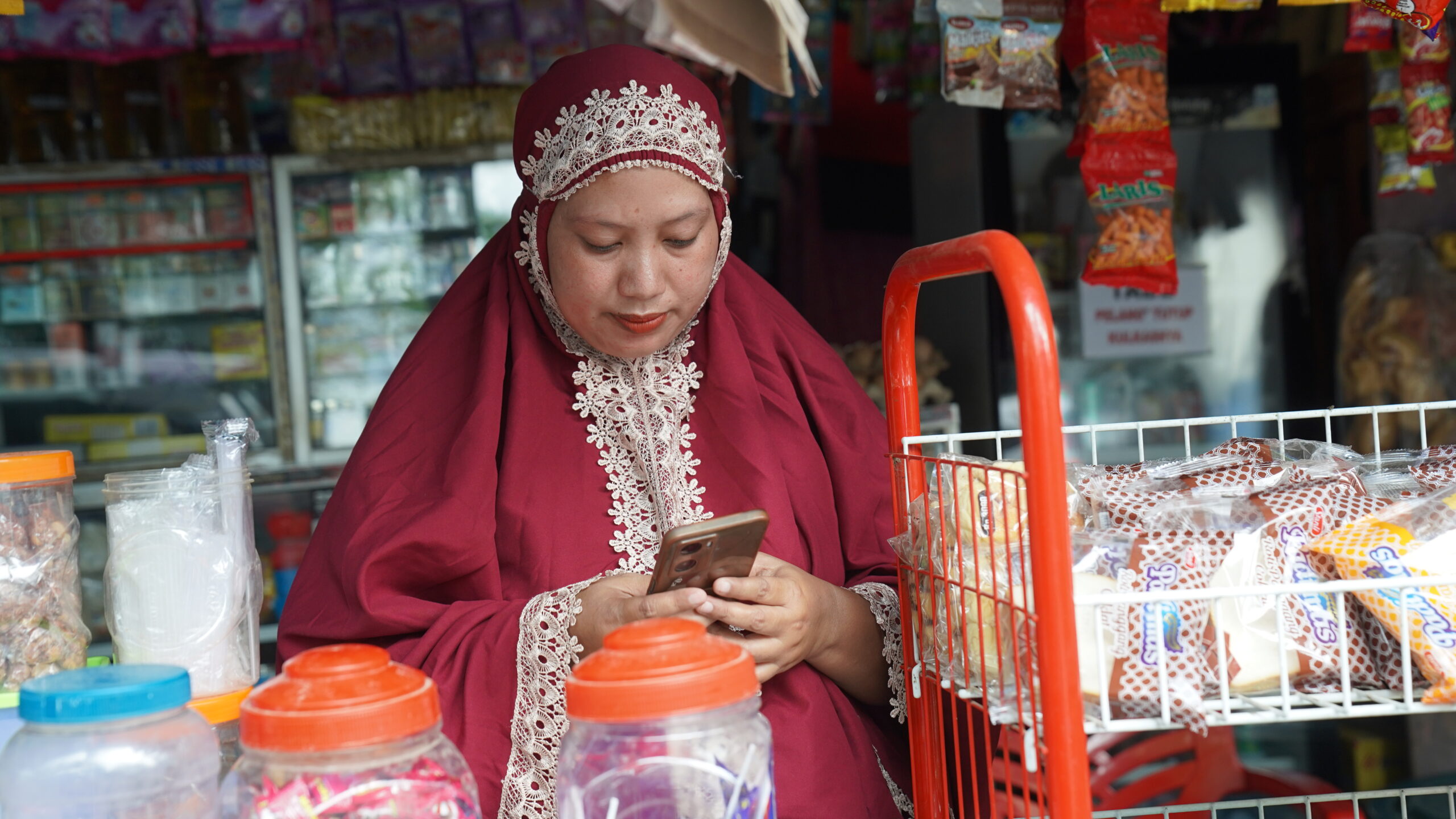 A woman using a phone. 