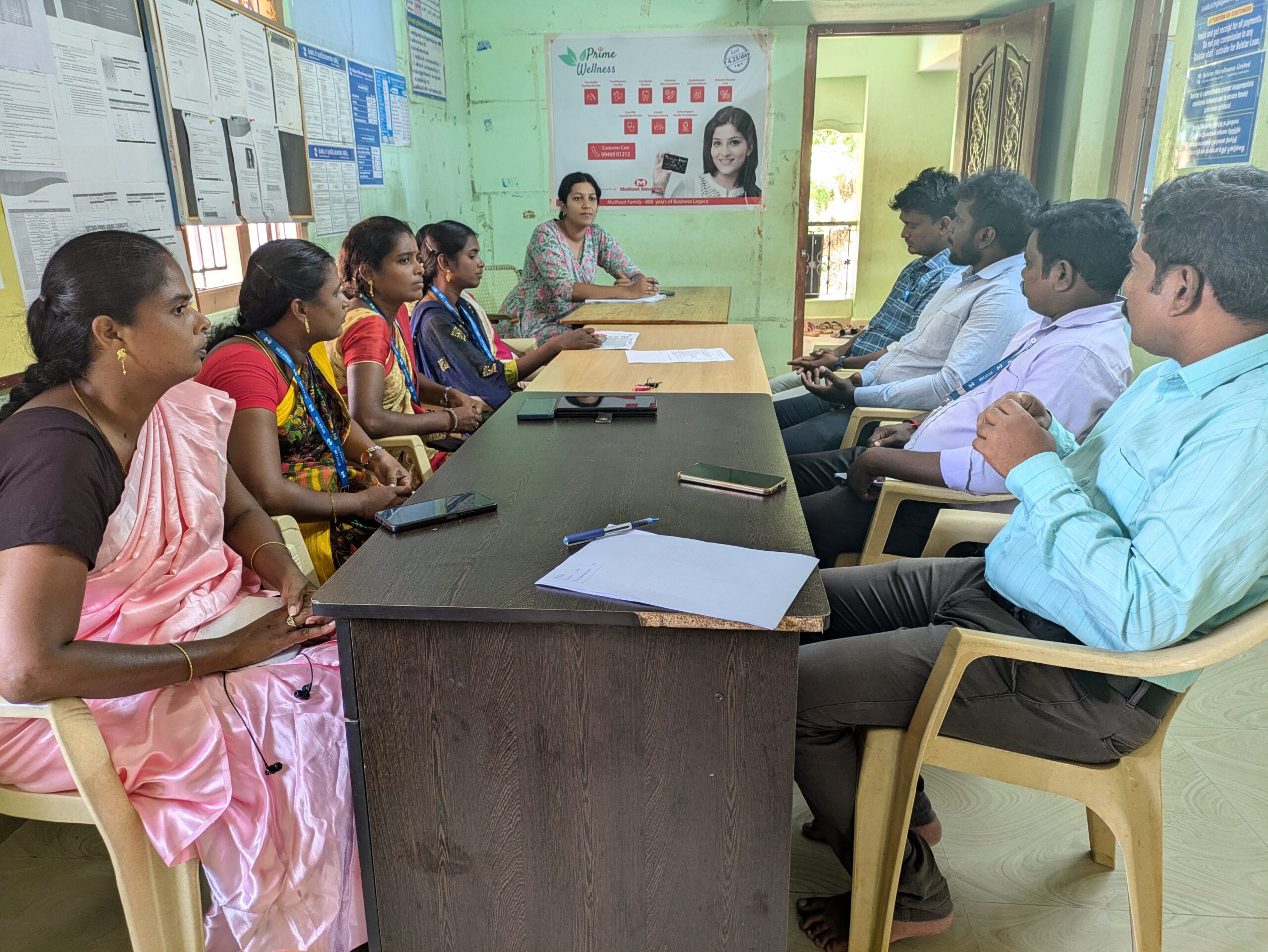 A group of people sitting in a room. 